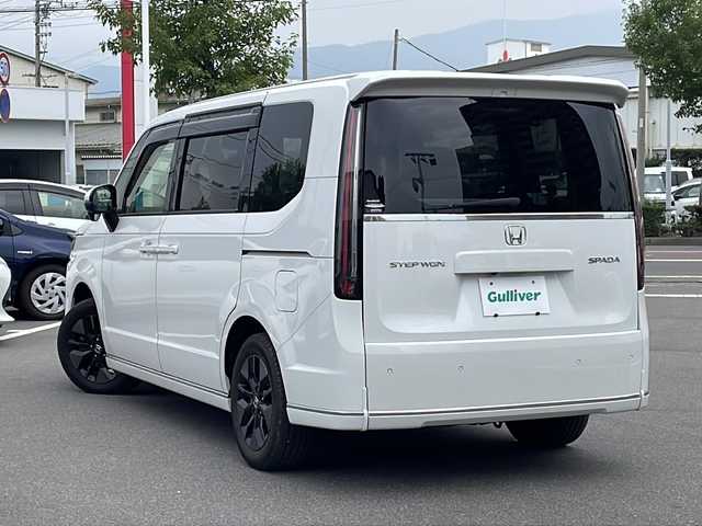ホンダ ステップワゴン 長野県 2022(令4)年 1.3万km パール 福祉車両　/両側電動ドア　/電動リアゲート　/プッシュスタート　/寒冷地仕様　/後席エアコン　/追従クルーズコントロール　/Bluetooth　/後席モニター　/ＵＳＢ入力端子　/バックカメラ　/フルセグTV　/ドラレコ/三列シート/ウォークスルー/ハーフレザーシート/レーンキープアシスト/衝突被害軽減装置/純正アルミ冬タイヤ車載/前後コーナーセンサー