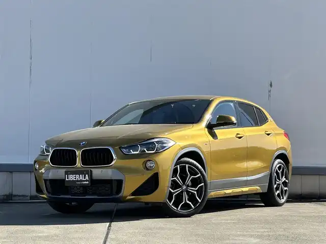 ＢＭＷ Ｘ２ xDrive 18d MスポーツX 東京都 2019(平31)年 5万km ゴールド ＨＵＤ　/純正ナビ　/バックカメラ　/アダプティブクルーズコントロール　/シートヒーター　/パーキングアシスト　/ＰＤＣ　/ＬＥＤヘッドライト　/オートライト　/純正１９インチＡＷ　/禁煙車　/電動リアゲート