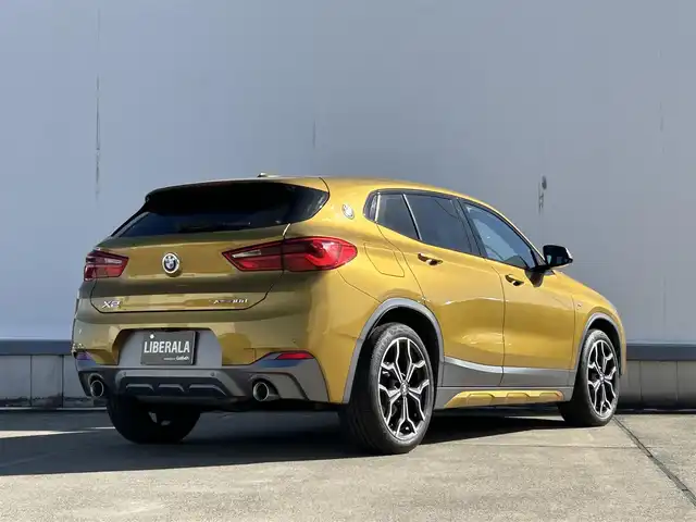 ＢＭＷ Ｘ２ xDrive 18d MスポーツX 東京都 2019(平31)年 5万km ゴールド ＨＵＤ　/純正ナビ　/バックカメラ　/アダプティブクルーズコントロール　/シートヒーター　/パーキングアシスト　/ＰＤＣ　/ＬＥＤヘッドライト　/オートライト　/純正１９インチＡＷ　/禁煙車　/電動リアゲート