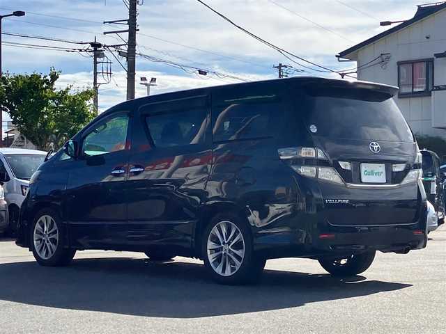 トヨタ ヴェルファイア 2．4Z プラチナセレクションⅡ 静岡県 2011(平23)年 7.4万km 黒 エンジンスタートボタン/パワーステアリング/パワーウィンドウ/スマートキー/Wオートエアコン/スペアキー１本/フリップダウンモニター/ETC/8インチナビ（CD/DVD/BT/フルセグ）/三列シート/オットマン/電動リアゲート/ウォークスルー/フロアマット/両側パワースライドドア/純正アルミホイール/ABS/横滑り防止装置/コーナーセンサー前後/オートライト/W＋サイドエアバック/カーテンエアバック