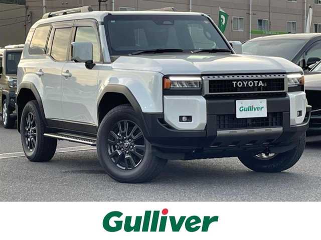 トヨタ ランドクルーザー ２５０ VX 広島県 2024(令6)年 0.1万km プラチナホワイトパールマイカ ワンオーナー/サンルーフ/純正ナビ（フルセグTV/Bluetooth）/全方位モニター/ETC2.0/デジタルインナーミラー/黒レザーシート/・シートヒーター/・エアシート/・パワーシート/衝突被害軽減ブレーキ/車線逸脱警報/オートマチックハイビーム/ブラインドスポットモニター/レーダークルーズコントロール/コーナーセンサー/純正フロアマット/純正ドアバイザー/ステアリングヒーター/スペアキー