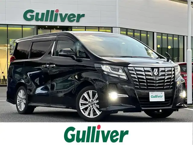 トヨタ アルファード S 山形県 2016(平28)年 11.4万km ブラック 登録時走行距離114775Km/保証書/取扱説明書/後席モニター（ALPINE）/社外SDナビ（ALPINE）/フルセグTV/黒革シートカバー/両側パワースライドドア/前後コーナーセンサー/トヨタセーフティセンス/7人乗り/オットマン/バックカメラ/LEDヘッドライト/ウィンカーミラー/電動格納ミラー/ETC/プッシュスタート/スタッドレスタイヤ車載