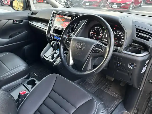 トヨタ アルファード S 山形県 2016(平28)年 11.4万km ブラック 登録時走行距離114775Km/保証書/取扱説明書/後席モニター（ALPINE）/社外SDナビ（ALPINE）/フルセグTV/黒革シートカバー/両側パワースライドドア/前後コーナーセンサー/トヨタセーフティセンス/7人乗り/オットマン/バックカメラ/LEDヘッドライト/ウィンカーミラー/電動格納ミラー/ETC/プッシュスタート/スタッドレスタイヤ車載