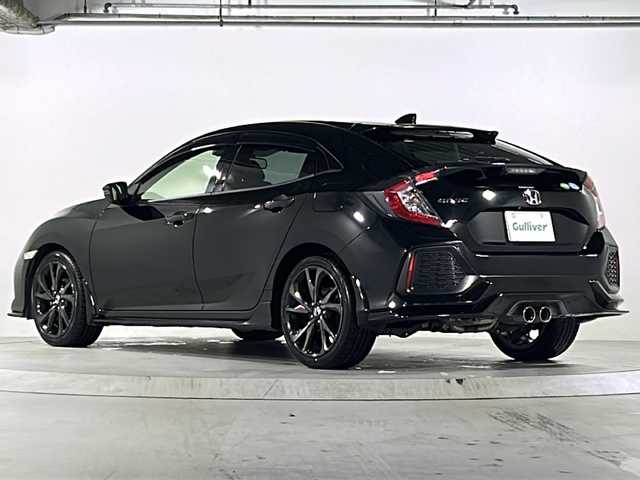 ホンダ シビック ハッチバック 広島県 2018(平30)年 4.8万km クリスタルブラックパール 禁煙/Honda SENSING/・衝突軽減ブレーキ〈CMBS〉/・渋滞追従機能付アダプティブ・クルーズ・コントロール/・LKAS〈車線維持支援システム〉/・路外逸脱抑制機能/・オートハイビーム/・標識認識機能/アジャイルハンドリングアシスト/純正ナビ（VXM-185VFi）/・フルセグ/CD/DVD/Bluetooth/SD/バックカメラ/革巻きステアリング/ステアリングスイッチ/パドルシフト/オートライト/シートヒーター/電動パーキングブレーキ/ブレーキホールド/スマートキー/プッシュスタート/スペアキー/純正ドライブレコーダー/ETC/ピアノブラック・フロントグリル/フロントスポイラー/純正１８インチアルミホイール/W+サイド+カーテンエアバック