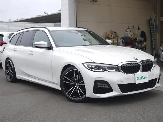 ＢＭＷ ３２０ｉ ツーリング Mスポーツ 静岡県 2020(令2)年 3.7万km 白 ワンオーナー／禁煙車/ドライビングアシストプロフェッショナル/　・衝突回避／被害軽減ブレーキ/　・アクティブクルーズコントロール/　・クロストラフィックフォーニング/　・エマージェンシーストップアシスト/　・ステアリング／レーンコントロールアシスト/　・トラフィックサインアシスト/　・レーンディパーチャーウォーニング/　・レーンチェンジウォーニング/　・アクティブサイドコリジョンプロテクション/　・前車接近警告機能／後車衝突警告機能/　・高速道路渋滞時ハンズオフアシスト/　・トラフィックサインアシスト（速度制限）/メーカーナビ/　BT/USB/AM.FM/SoreenMirooring/バックカメラ/ミラー一体型ETC/純正前後ドライブレコーダー/パドルシフト/おくだけ充電/前席シートヒーター／パワーシート（運転席メモリー機能付/プッシュスタート／スマートキー2個/パワーバックドア/ルーフレール/Eibachiサスペンション/純正フロアマット/取扱説明書／保証書