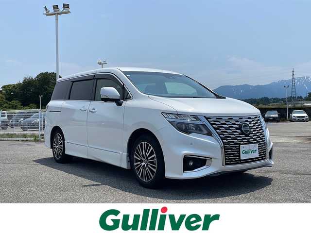 日産 エルグランド 250ハイウェイスター プレミアム 富山県 2022(令4)年 2.3万km ピュアホワイトパール ４ＷＤ　/純正１０インチナビ(MM521D-L)/(TV/BT/CD/DVD/BD)/全方位カメラ　/両側パワースライドドア　/パワーバックドア/アダプティブクルーズコントロール　/衝突被害軽減ブレーキ　/Ｗエアコン　/シートヒーター(D/N)　/ブラインドスポットモニター/ナビ連動ドライブレコーダー(DH5-D)　/純正ビルトインＥＴＣ2.0/パワーシート(D/N)/コーナーセンサー前後/2列目オットマン/スペアキー/オートハイビーム/取扱説明書/保証書/ナビ取扱説明書/ドラレコ取扱説明書/ETC取扱説明書