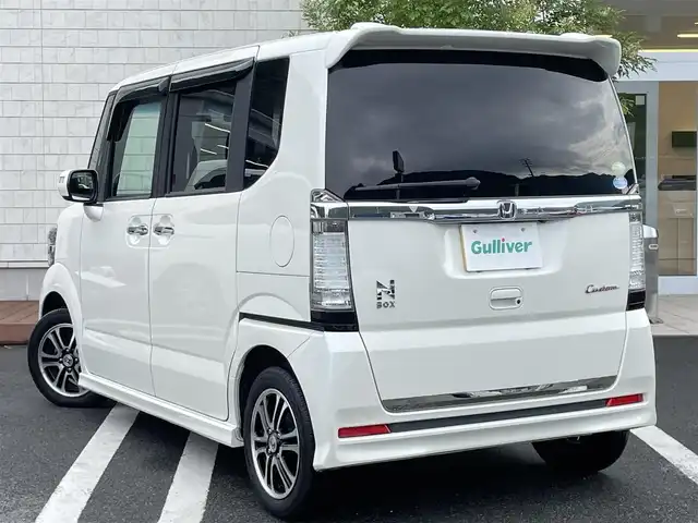ホンダ Ｎ ＢＯＸ カスタム G SSパッケージ 愛媛県 2013(平25)年 8.1万km プレミアムホワイトパール 社外ナビ(CN-RE03D)/・Bluetooth/・CD/DVD/フルセグTV/後席モニター(ALPINE パッケージ-M900SC)/バックカメラ/両側パワースライドドア/ETC/前方ドライブレコーダー/社外フロアマット/純正14インチAW/オートライト/オートマチックハイビーム/LEDヘッドライト/ステアリングスイッチ/ドアバイザー
