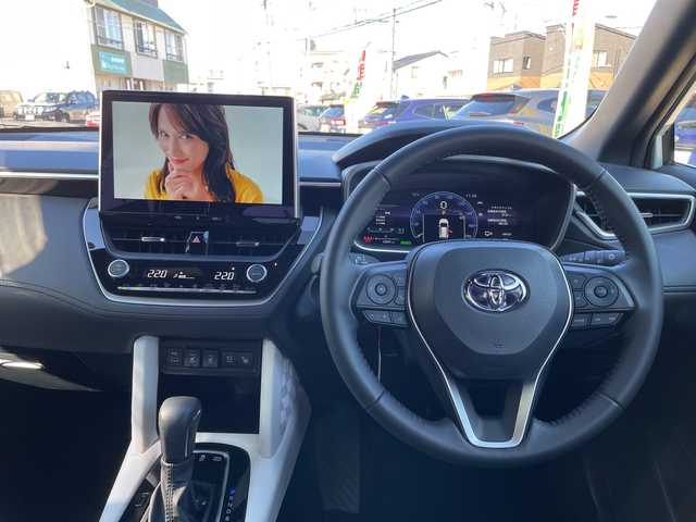 トヨタ カローラ クロス ハイブリッド Z 石川県 2024(令6)年 1.5万km パール モデリスタエアロ　純正１０．５型ナビ　フルセグＴＶ　パノラマモニター　ＬＥＤヘッドライト　ハーフレザーシート　シートヒーター　ＢＳＭ　純正アルミホイール　トヨタセーフティセンス　レーダークルーズ　ETC　スマートキー　プッシュスタート　電動ミラー　保証書