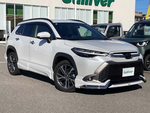 トヨタ カローラ クロス ハイブリッド Z 石川県 2024(令6)年 1.5万km パール モデリスタエアロ　純正１０．５型ナビ　フルセグＴＶ　パノラマモニター　ＬＥＤヘッドライト　ハーフレザーシート　シートヒーター　ＢＳＭ　純正アルミホイール　トヨタセーフティセンス　レーダークルーズ　ETC　スマートキー　プッシュスタート　電動ミラー　保証書