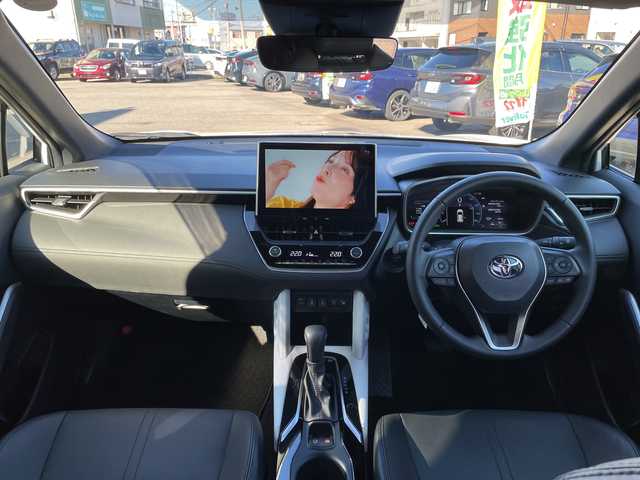 トヨタ カローラ クロス ハイブリッド Z 石川県 2024(令6)年 1.5万km パール モデリスタエアロ　純正１０．５型ナビ　フルセグＴＶ　パノラマモニター　ＬＥＤヘッドライト　ハーフレザーシート　シートヒーター　ＢＳＭ　純正アルミホイール　トヨタセーフティセンス　レーダークルーズ　ETC　スマートキー　プッシュスタート　電動ミラー　保証書