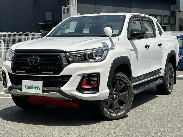 トヨタ ハイラックス Z ブラックラリーエディション 福岡県 2019(令1)年 12.1万km スーパーホワイトⅡ ワンオーナー/禁煙車/社外ナビ/（BT・CD・DVD・TV)/TRD仕様/クルーズコントロール/本革ステアリング/ステアリングリモコン/前後ドライブレコーダー/PWR　HEAT/ETC/プッシュスタート/ダウンヒルアシストコントロール/センターデフロック/バックカメラ/純正フロアマット/純正アルミホイール/MTモード付きAT/ドアバイザー/スペアスマートキー×１/保証書/取扱説明書