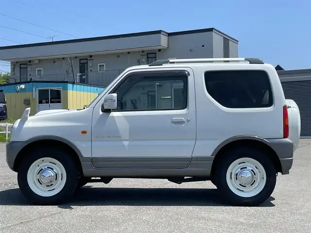 スズキ ジムニー ランドベンチャー 道央・札幌 2008(平20)年 6.5万km パールホワイト ４WD/社外オーディオ/CD/MD/AUX/トランスファ切替/D席シートヒーター/ハーフレザーシート/リモコンキー/ハロゲンヘッドライト/電動格納ミラー/ウィンカーミラー/純正フロアマット/ドアバイザー/AW付冬タイヤ積込（センターキャップ欠品）/175/80/R16/2023年/山8mm