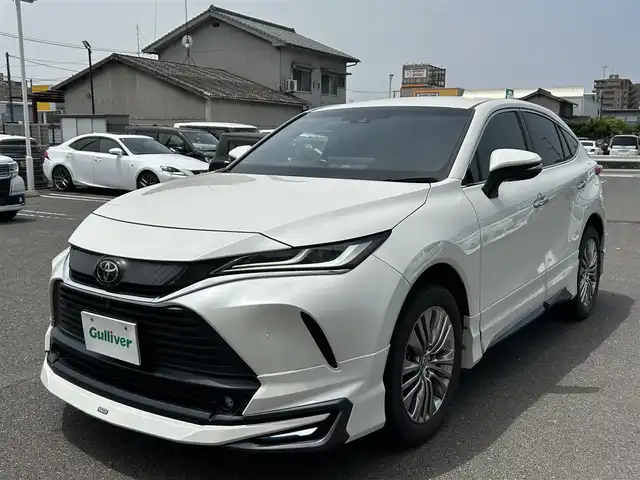 トヨタ ハリアー Z 広島県 2020(令2)年 2.9万km ホワイトパールクリスタルシャイン MODELISTAエアロ/[デイライト付き]/JBLプレミアムサウンド/フルセグTV/アイドリングストップ/レーダクルーズコントロール/ブラインドスポットモニター/リアクロストラフィックアラート/電動パーキングシステム/電動リアゲート/ブレーキホールド/全方位カメラ/ETC2.0[ビルトイン]/パワーシート[D席]/LED[ヘッド/フォグ]/オートマチックハイビーム/デジタルインナーミラー/クリアランスソナー/プッシュスタート/[Bluetooth/AM/FM]/純正フロアマット/純正アルミ/スペアキー/[1本]/保証書/取扱説明書