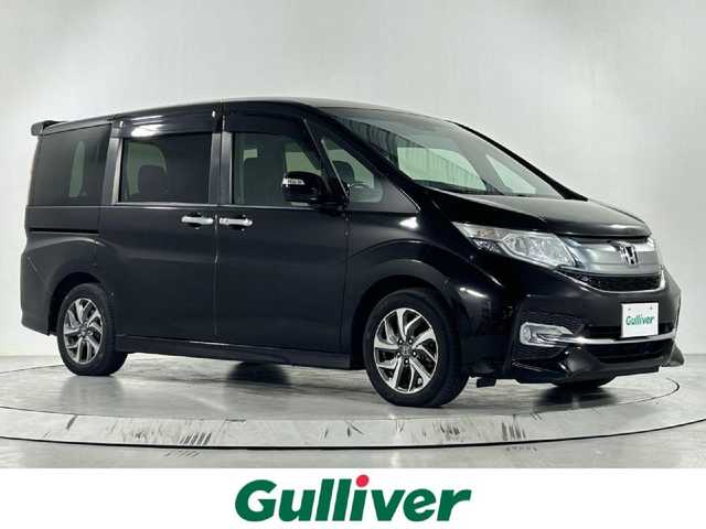 ホンダ ステップワゴン スパーダ 佐賀県 2015(平27)年 10.8万km プレミアムスパークルブラックパール 純正9インチナビ/Bluetooth/フルセグ/AM/FMCD/DVD/バックカメラ/ホンダセンシング/衝突軽減ブレーキ/オートクルーズコントロール/車線逸脱警報/レーンキープアシスト/誤発進抑制機能/先行車発進通知/標識認識機能/フリップダウンモニター/LEDヘッドライト/オートライト/片側パワースライドドア/ステアリングリモコン
