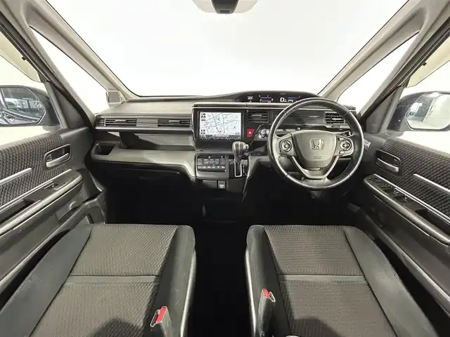 ホンダ ステップワゴン スパーダ 佐賀県 2015(平27)年 10.8万km プレミアムスパークルブラックパール 純正9インチナビ/Bluetooth/フルセグ/AM/FMCD/DVD/バックカメラ/ホンダセンシング/衝突軽減ブレーキ/オートクルーズコントロール/車線逸脱警報/レーンキープアシスト/誤発進抑制機能/先行車発進通知/標識認識機能/フリップダウンモニター/LEDヘッドライト/オートライト/片側パワースライドドア/ステアリングリモコン