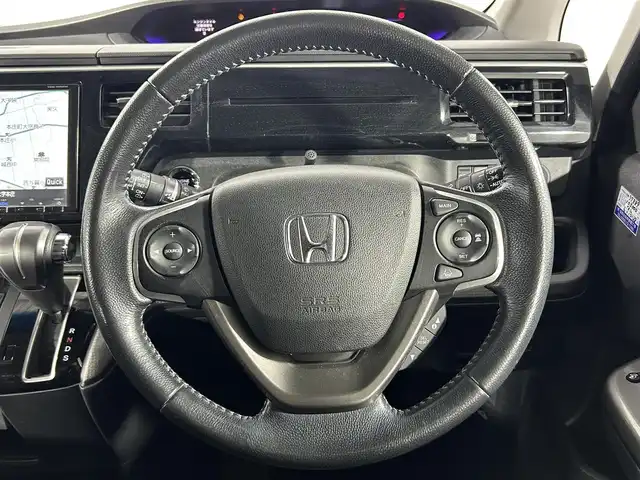 ホンダ ステップワゴン スパーダ 佐賀県 2015(平27)年 10.8万km プレミアムスパークルブラックパール 純正9インチナビ/Bluetooth/フルセグ/AM/FMCD/DVD/バックカメラ/ホンダセンシング/衝突軽減ブレーキ/オートクルーズコントロール/車線逸脱警報/レーンキープアシスト/誤発進抑制機能/先行車発進通知/標識認識機能/フリップダウンモニター/LEDヘッドライト/オートライト/片側パワースライドドア/ステアリングリモコン