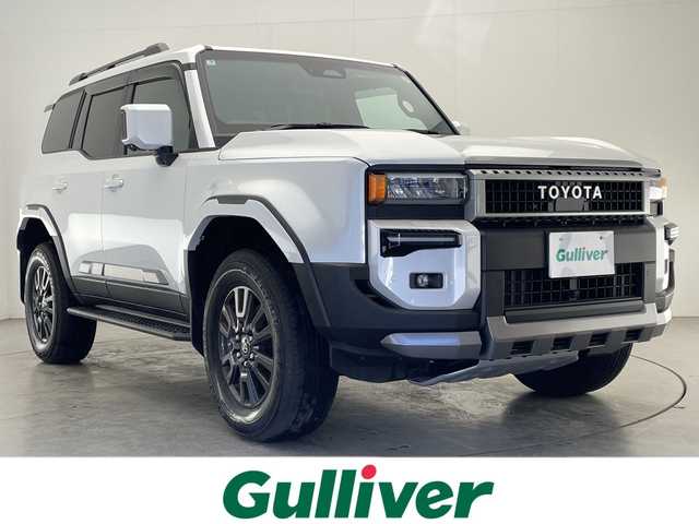 トヨタ ランドクルーザー ２５０ VX 宮崎県 2025(令7)年 0.4万km プラチナホワイトパールマイカ ワンオーナー/サンルーフ/Toyota Safety Sense/〇プリクラッシュセーフティ/〇レーンディパーチャーアラート/〇ブラインドスポットモニター/〇リアクロストラフィックアラート/〇プロアクティブドライビングアシスト/〇後側車両接近告知/〇リヤカメラディクション/〇安心降車アシスト/〇周辺車両接近時サポート/〇オートマチックハイビーム/〇レーダークルーズコントロール/〇クリアランスソナー/〇ロードサインアシスト/〇パーキングサポートブレーキ/〇発進遅れ告知/デジタルインナーミラー/純正12.3インチナビ/フルセグTV/パノラミックビューモニター/黒本革シート/シートヒーター/シートベンチレーション/ステアリングヒーター/パワーシート/パワーバックドア/ビルトインETC2.0/純正18インチAW/純正フロアマット/保証書/取扱説明書