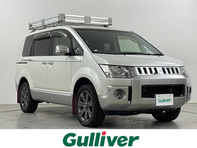 三菱 デリカＤ：５ ジャスパー 道央・札幌 2018(平30)年 7.7万km ウォームホワイトP/スターリングシルバーM ・４WD/・社外ナビゲーション/・CD/DVD/Bluetooth/フルセグ/・バックカメラ/・クルーズコントロール/・横滑り防止装置/・コーナーセンサー/・スマートキー/・ETC/・ドライブレコーダー/・両側パワースライドドア/・運転席パワーシート/・前席シートヒーター/・純正AW/・オートライト/・LEDヘッドライト/・純正フロアマット/・後付けリアラダー、ルーフキャリア、マッドフラップ
