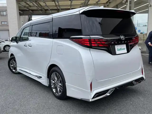 トヨタ アルファード Z 神奈川県 2024(令6)年 0.1万km プラチナホワイトパールマイカ ワンオーナー/モデリスタエアロ/マフラー/左右独立ムーンルーフ/ユニバーサルステップ/黒革シート/純正メモリーナビ・地デジTV/純正13.2インチ有機ELフリップダウンモニター/全方位カメラ/USB/BT/Miracast/HDMI再生/ワイヤレス充電/ビルトインETC2.0/前後ドライブレコーダー/トヨタセーフティセンス/両側パワースライドドア/純正18インチAW/LEDライト/LEDフォグ/パワーバックドア/コーナーセンサー/プッシュスタート/スマートキー×2/AC100V/ステアスイッチ/R7年ディーラー整備記録/保証書・ユーザーガイドあり