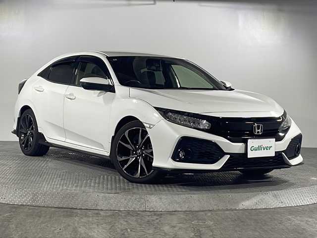 ホンダ シビック ハッチバック 沖縄県 2018(平30)年 8.7万km ホワイトオーキッドパール 禁煙車/ターボ車/衝突軽減ブレーキ/車線逸脱警報/純正ナビ/AM/FM/CD/DVD/ワンセグTV/Bluetooth/バックカメラ/追従式クルーズコントロール/レザーシート/パワーシート/シートヒーター/LEDヘッドライト/純正ドライブレコーダー前方/ビルトインETC/純正18インチアルミホイール/オートライト/保証書/取扱説明書/ABS/カーテンエアバッグ