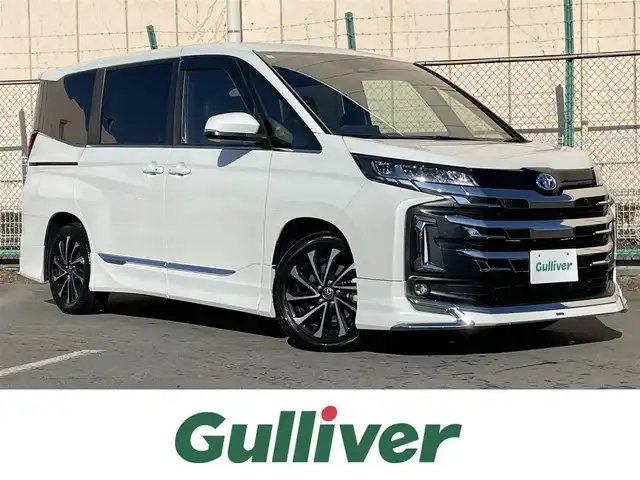 トヨタ ノア ハイブリッド S－Z 東京都 2024(令6)年 2.2万km ホワイトパールクリスタルシャイン 純正ナビ　/Ｂｌｕｅｔｏｏｔｈ　/ＣＤ　/ＤＶＤ　/フルセグＴＶ　/ＵＳＢ　/バックカメラ　/モデリスタフルエアロ　/フリップダウンモニター　/追従型クルーズコントロールシステム　/ＥＴＣ２．０　　/純正アルミホイール/ABS/横滑り防止装置/コーナーセンサー/レーンアシスト/とう純正ナビ　/Ｂｌｕｅｔｏｏｔｈ　/ＣＤ　/ＤＶＤ　/フルセグＴＶ　/ＵＳＢ　/バックカメラ　/モデリスタフルエアロ　/フリップダウンモニター　/追従型クルーズコントロールシステム　/ＥＴＣ２．０　　/純正アルミホイール/ABS/横滑り防止装置/コーナーセンサー/レーンアシスト