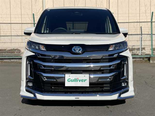 トヨタ ノア ハイブリッド S－Z 東京都 2024(令6)年 2.2万km ホワイトパールクリスタルシャイン 純正ナビ　/Ｂｌｕｅｔｏｏｔｈ　/ＣＤ　/ＤＶＤ　/フルセグＴＶ　/ＵＳＢ　/バックカメラ　/モデリスタフルエアロ　/フリップダウンモニター　/追従型クルーズコントロールシステム　/ＥＴＣ２．０　　/純正アルミホイール/ABS/横滑り防止装置/コーナーセンサー/レーンアシスト/とう純正ナビ　/Ｂｌｕｅｔｏｏｔｈ　/ＣＤ　/ＤＶＤ　/フルセグＴＶ　/ＵＳＢ　/バックカメラ　/モデリスタフルエアロ　/フリップダウンモニター　/追従型クルーズコントロールシステム　/ＥＴＣ２．０　　/純正アルミホイール/ABS/横滑り防止装置/コーナーセンサー/レーンアシスト