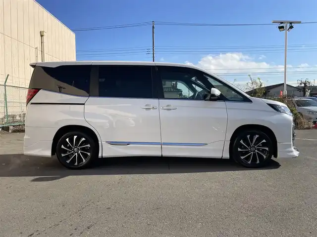 トヨタ ノア ハイブリッド S－Z 東京都 2024(令6)年 2.2万km ホワイトパールクリスタルシャイン 純正ナビ　/Ｂｌｕｅｔｏｏｔｈ　/ＣＤ　/ＤＶＤ　/フルセグＴＶ　/ＵＳＢ　/バックカメラ　/モデリスタフルエアロ　/フリップダウンモニター　/追従型クルーズコントロールシステム　/ＥＴＣ２．０　　/純正アルミホイール/ABS/横滑り防止装置/コーナーセンサー/レーンアシスト/とう純正ナビ　/Ｂｌｕｅｔｏｏｔｈ　/ＣＤ　/ＤＶＤ　/フルセグＴＶ　/ＵＳＢ　/バックカメラ　/モデリスタフルエアロ　/フリップダウンモニター　/追従型クルーズコントロールシステム　/ＥＴＣ２．０　　/純正アルミホイール/ABS/横滑り防止装置/コーナーセンサー/レーンアシスト