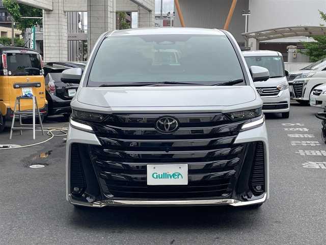 トヨタ ヴェルファイア ハイブリット Z プレミア 東京都 2023(令5)年 1.1万km プラチナホワイトパールマイカ トヨタセーフティーセンス/ワンオーナー/純正SDナビ/・フルセグTV/・FM・AM/・Bluetooth接続/本革レザーシート（茶）/・パワーシート/・後席エグゼクティブパワーシート/・シートヒーター/・エアーシート/両サイドムーンルーフ/後席フリップダウンモニター/バックカメラ/全周囲カメラ/両側パワースライドドア/パワーバックドア/デジタルインナーミラー/レーダークルーズコントロール/ヘッドアップディスプレイ/USB・Cタイプ入力端子/ドラレコ/ETC/WAC/19インチ純正AW/おくだけ充電/スマートキー/スペアキー/ABS/横滑り防止/取扱説明書＆保証書