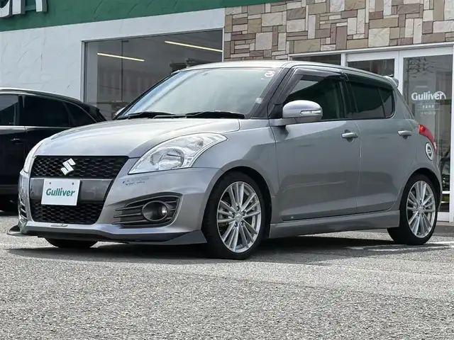 スズキ スイフト スポーツ 徳島県 2014(平26)年 5.1万km プレミアムシルバーメタリック ナビ（CN-R3012）/エアロ（フロント）/クルーズコントロール/ETC/フルセグTV/社外フロアマット/プッシュスタート/スマートキー/パドルシフト/ドアバイザー/USB入力端子