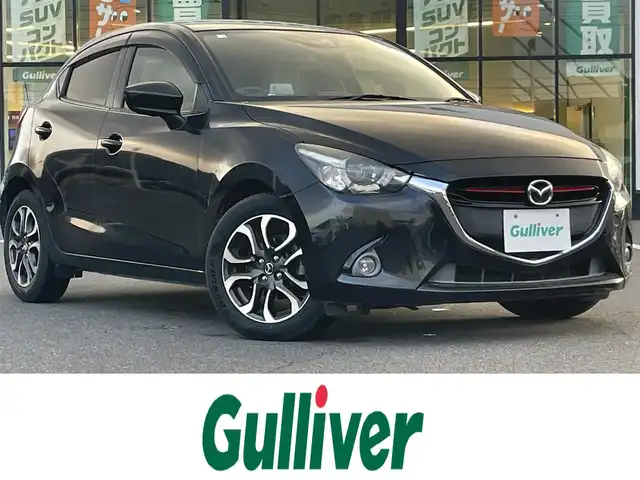 マツダ デミオ XD ツーリング Lパッケージ 岡山県 2014(平26)年 6.8万km ジェットブラックマイカ 登録時走行距離67249km/純正ナビ/フルセグTV(AM/FM/CD/DVD/Bluetooth)/ETC/ヘッドアップディスプレイ/クルーズコントロール/衝突軽減ブレーキ/LEDヘッドライト/パドルシフト/アイドリングストップ/ハーフレザーシート/横滑り防止/オートライト/スマートキー/純正フロアマット/16インチ純正AW/社外レーダー探知機