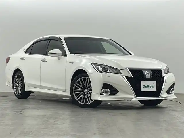 トヨタ クラウン ハイブリッド アスリートG Four 福島県 2015(平27)年 10.6万km ホワイトパールクリスタルシャイン トヨタセーフティーセンス　/・PCS/・車線逸脱警報/・オートマチックハイビーム/・レーダークルーズコントロール/純正HDDナビゲーション/【AM/FM/DVD/CD/Bluetooth/フルセグ】/バックカメラ　/レザーシート　/・パワーシート　/・シートヒーター　/オービスレーダー　/クリアランスソナー　/革巻きステアリング　/・ステアリングスイッチ　/プッシュスタート　/・スマートキー/LEDライト/・オートライト/電動格納ミラー