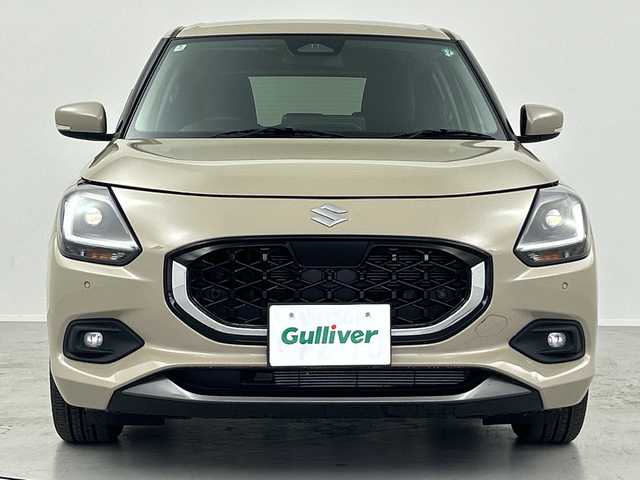 スズキ スイフト HYBRID MZ 福島県 2024(令6)年 0.3万km キャラバンアイボリーPM /禁煙車　//純正９インチディスプレイオーディオ(FM/AM/BTA)//Apple car Play//Android Auto//衝突被害軽減ブレーキ　//アダプティブクルーズコントロール　//ブラインドスポットモニター　//シートヒーター(D/N)//スペアキー　//オートハイビーム//ＬＥＤヘッドライト//USB入力端子//コーナーセンサー//電動パーキングブレーキ//ブレーキホールド