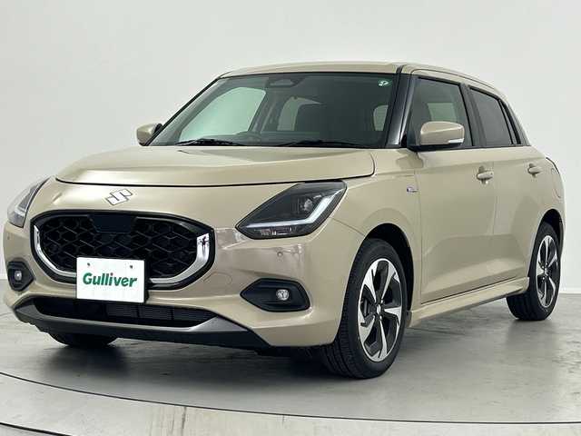 スズキ スイフト HYBRID MZ 福島県 2024(令6)年 0.3万km キャラバンアイボリーPM /禁煙車　//純正９インチディスプレイオーディオ(FM/AM/BTA)//Apple car Play//Android Auto//衝突被害軽減ブレーキ　//アダプティブクルーズコントロール　//ブラインドスポットモニター　//シートヒーター(D/N)//スペアキー　//オートハイビーム//ＬＥＤヘッドライト//USB入力端子//コーナーセンサー//電動パーキングブレーキ//ブレーキホールド