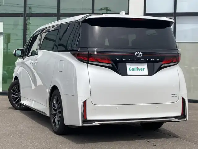 トヨタ ヴェルファイア ハイブリット Z プレミア 道南・函館 2023(令5)年 4.1万km プラチナホワイトパールマイカ ・純正ディスプレイオーディオ（コネクティッドナビ対応）/・フルセグTV/・カメラ一体型ドライブレコーダー/・パノラミックビューモニター/・ヘッドアップディスプレイ/・デジタルインナーミラー/・HDMI接続/・ルーフサンシェード/・サイドサンシェード/・両側パワースライドドア/・オートステップ/・パワーバックドア/・快適温熱シート（フロント・セカンドシート）/・ベンチレーションシート（フロント・セカンドシート）/・電動オットマン/・セカンドシートサイドテーブル/・ステアリングヒーター/・リヤヒーターエアカーテン/・ナノイーX/・ワイヤレスパワーコンソーシアム/・プリクラッシュセーフティ/・レーンディパーチャーアラート/・レーダークルーズコントロール/・ブラインドスポットモニター/・オートマチックハイビーム/・LEDヘッドライト/・オートライト/・エンジンプッシュスタート/・スマートキー/・保証書