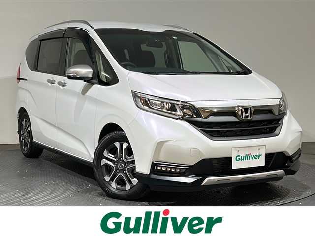 ホンダ フリード クロスター ホンダセンシング 愛媛県 2022(令4)年 1.3万km プラチナホワイトパール ・ホンダセンシング/・アクティブコーナリングライト/・純正メモリーナビ/・バックカメラ/・ETC/・ドライブレコーダー/・ハーフレザーシート/・前席シートヒーター/・LEDヘッドライト/・フォグランプ/・スマートキー