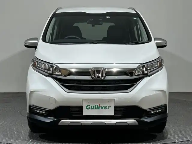ホンダ フリード クロスター ホンダセンシング 愛媛県 2022(令4)年 1.3万km プラチナホワイトパール ・ホンダセンシング/・アクティブコーナリングライト/・純正メモリーナビ/・バックカメラ/・ETC/・ドライブレコーダー/・ハーフレザーシート/・前席シートヒーター/・LEDヘッドライト/・フォグランプ/・スマートキー