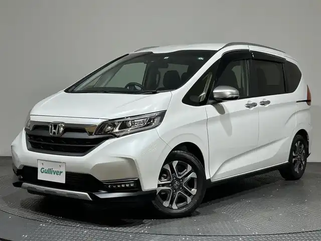 ホンダ フリード クロスター ホンダセンシング 愛媛県 2022(令4)年 1.3万km プラチナホワイトパール ・ホンダセンシング/・アクティブコーナリングライト/・純正メモリーナビ/・バックカメラ/・ETC/・ドライブレコーダー/・ハーフレザーシート/・前席シートヒーター/・LEDヘッドライト/・フォグランプ/・スマートキー