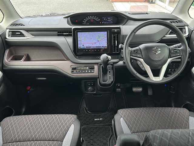 スズキ ソリオ バンディット HV MV 福岡県 2022(令4)年 3.8万km グリッターバイオレットパール ・9インチナビ/（BLUETOOTH/フルセグ/バックカメラ/・アラウンドビューモニター/・ビルトインETC/・ドライブレコーダー/・ヘッドアップディスプレイ/・スペアキー/・純正アルミホイール/・純正フロアマット/・両側パワースライドドア/・シートヒーター/・LEDヘッドライト/・天井サーキュレーター/・クルーズコントロール/・アイドリングストップ/・クリアランスソナー/・オールリトラミラー/・コーナーセンサー/・レーンキープアシスト/・横滑り防止装置/・衝突軽減システム/・USB入力端子/・センターウォークスルー/・オートライト/・保証書/・取扱説明書