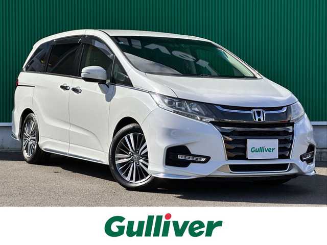 ホンダ オデッセイ アブソルート ホンダセンシング 宮城県 2019(平31)年 4.3万km プラチナホワイトパール 2列目プレミアムクレードルシート/17インチアルミホイール/＝＝＝/ホンダセンシング/●衝突軽減ブレーキ〈CMBS〉/●誤発進抑制機能/●歩行者事故低減ステアリング/●路外逸脱抑制機能/●ACC〈アダプティブ・クルーズ・コントロール〉/●LKAS〈車線維持支援システム〉/●先行車発進お知らせ機能/●標識認識機能/Gathers９インチインターナビ/【VXM-197VFNi】/Bluetooth/CD/DVD/SD/HDMI/USB/Apple CarPlay/フルセグTV/バックカメラ/純正前後ドライブレコーダー/純正ETC2.0/ハーフレザーシート/パワーシート/LEDヘッドライト/ステアリングスイッチ/パドルシフト/保証書/取扱説明書/スペアキー×1