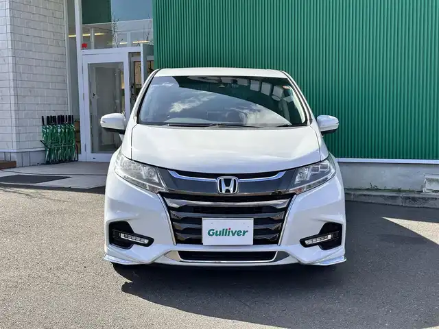 ホンダ オデッセイ アブソルート ホンダセンシング 宮城県 2019(平31)年 4.3万km プラチナホワイトパール 2列目プレミアムクレードルシート/17インチアルミホイール/＝＝＝/ホンダセンシング/●衝突軽減ブレーキ〈CMBS〉/●誤発進抑制機能/●歩行者事故低減ステアリング/●路外逸脱抑制機能/●ACC〈アダプティブ・クルーズ・コントロール〉/●LKAS〈車線維持支援システム〉/●先行車発進お知らせ機能/●標識認識機能/Gathers９インチインターナビ/【VXM-197VFNi】/Bluetooth/CD/DVD/SD/HDMI/USB/Apple CarPlay/フルセグTV/バックカメラ/純正前後ドライブレコーダー/純正ETC2.0/ハーフレザーシート/パワーシート/LEDヘッドライト/ステアリングスイッチ/パドルシフト/保証書/取扱説明書/スペアキー×1