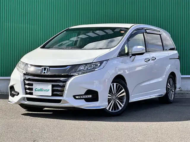 ホンダ オデッセイ アブソルート ホンダセンシング 宮城県 2019(平31)年 4.3万km プラチナホワイトパール 2列目プレミアムクレードルシート/17インチアルミホイール/＝＝＝/ホンダセンシング/●衝突軽減ブレーキ〈CMBS〉/●誤発進抑制機能/●歩行者事故低減ステアリング/●路外逸脱抑制機能/●ACC〈アダプティブ・クルーズ・コントロール〉/●LKAS〈車線維持支援システム〉/●先行車発進お知らせ機能/●標識認識機能/Gathers９インチインターナビ/【VXM-197VFNi】/Bluetooth/CD/DVD/SD/HDMI/USB/Apple CarPlay/フルセグTV/バックカメラ/純正前後ドライブレコーダー/純正ETC2.0/ハーフレザーシート/パワーシート/LEDヘッドライト/ステアリングスイッチ/パドルシフト/保証書/取扱説明書/スペアキー×1