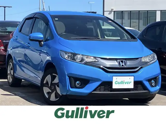 ホンダ フィット ハイブリット Fパッケージ 道南・函館 2014(平26)年 7.7万km ビビットスカイブルーP 純正ナビ/ワンセグＴＶ/衝突軽減ブレーキ/バックカメラ/寒冷地仕様/オートライト/ＨＩＤヘッドライト/ＵＳＢ・ＢＴ接続/社外フロアマット/アイドリングストップ/横滑り防止装置/電格ミラー