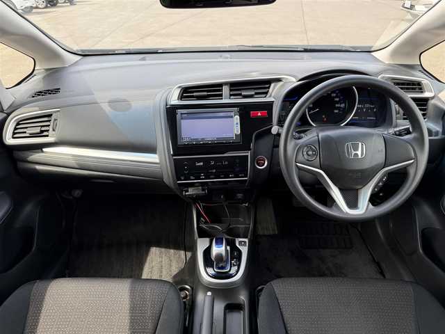 ホンダ フィット ハイブリット Fパッケージ 道北・旭川 2014(平26)年 7.7万km ビビットスカイブルーP 純正ナビ/ワンセグＴＶ/衝突軽減ブレーキ/バックカメラ/寒冷地仕様/オートライト/ＨＩＤヘッドライト/ＵＳＢ・ＢＴ接続/社外フロアマット/アイドリングストップ/横滑り防止装置/電格ミラー