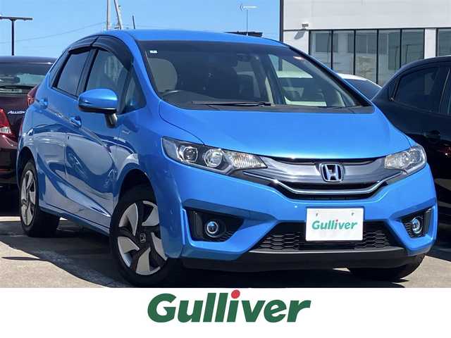 ホンダ フィット ハイブリット Fパッケージ 道北・旭川 2014(平26)年 7.7万km ビビットスカイブルーP 純正ナビ/ワンセグＴＶ/衝突軽減ブレーキ/バックカメラ/寒冷地仕様/オートライト/ＨＩＤヘッドライト/ＵＳＢ・ＢＴ接続/社外フロアマット/アイドリングストップ/横滑り防止装置/電格ミラー