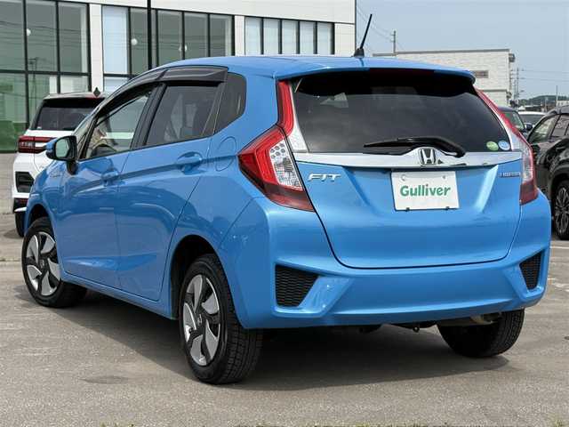 ホンダ フィット ハイブリット Fパッケージ 道北・旭川 2014(平26)年 7.7万km ビビットスカイブルーP 純正ナビ/ワンセグＴＶ/衝突軽減ブレーキ/バックカメラ/寒冷地仕様/オートライト/ＨＩＤヘッドライト/ＵＳＢ・ＢＴ接続/社外フロアマット/アイドリングストップ/横滑り防止装置/電格ミラー