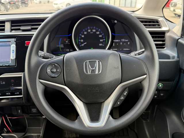 ホンダ フィット ハイブリット Fパッケージ 道北・旭川 2014(平26)年 7.7万km ビビットスカイブルーP 純正ナビ/ワンセグＴＶ/衝突軽減ブレーキ/バックカメラ/寒冷地仕様/オートライト/ＨＩＤヘッドライト/ＵＳＢ・ＢＴ接続/社外フロアマット/アイドリングストップ/横滑り防止装置/電格ミラー