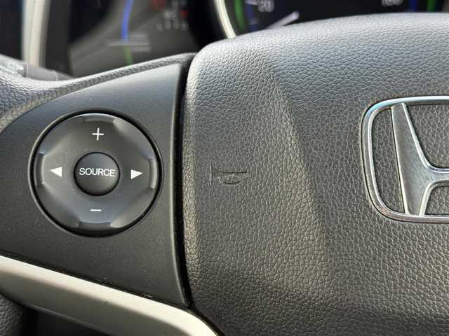 ホンダ フィット ハイブリット Fパッケージ 道北・旭川 2014(平26)年 7.7万km ビビットスカイブルーP 純正ナビ/ワンセグＴＶ/衝突軽減ブレーキ/バックカメラ/寒冷地仕様/オートライト/ＨＩＤヘッドライト/ＵＳＢ・ＢＴ接続/社外フロアマット/アイドリングストップ/横滑り防止装置/電格ミラー