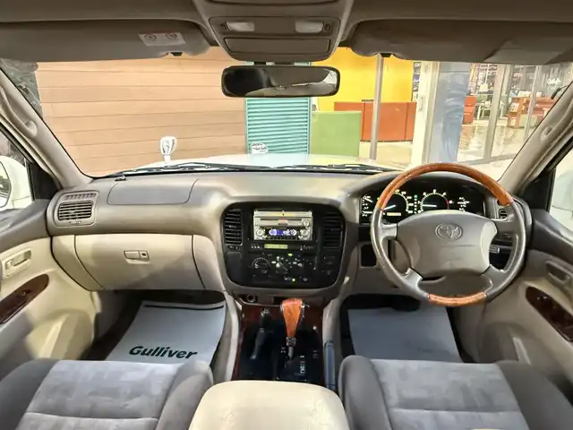 トヨタ ランドクルーザー VX－LTD 香川県 2001(平13)年 9.7万km ホワイトパールマイカ ワンオーナー/ウッドコンビステア/クルーズコントロール/社外LEDヘッドライト/社外16インチアルミ/純正マット/ETC