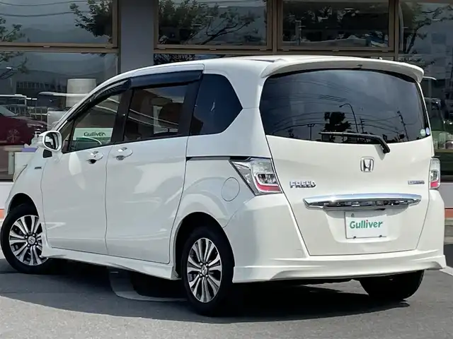 ホンダ フリード ハイブリット ジャストセレクション 長野県 2012(平24)年 14.3万km プレミアムホワイトパール 社外ナビ（FM/AM、CD、DVD、USB）/バックカメラ/フルセグテレビ/クルーズコントロール追従有/社外ETC/両側パワースライドドア/横滑り防止装置/盗難防止装置/純正フロアマット/ダブルエアバック/キセノンオートヘッドライト/エンジンスターター/革ステアリング/スペアキー（１本）/取扱説明書/ABS