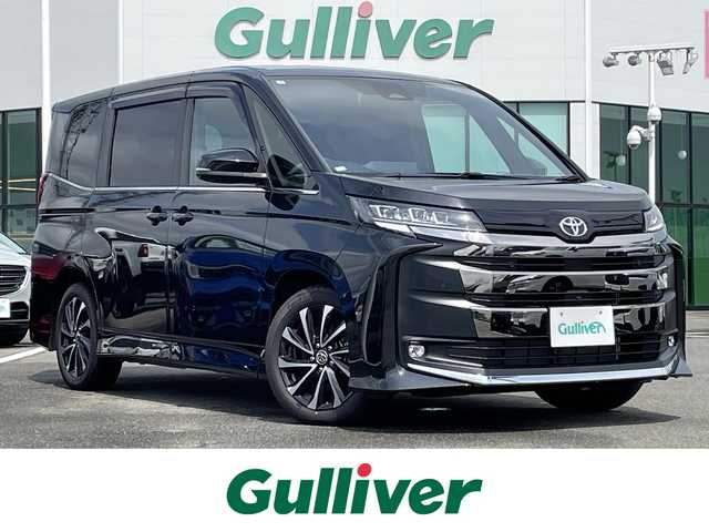 トヨタ ノア S－Z 佐賀県 2025(令7)年 0.1千km グリッターブラックガラスフレーク 登録時走行距離33Km/純正10.5インチディスプレイオーディオ(ナビ機能付)/・フルセグTV/CD/DVD/USB/HDMI/Bluetooth/純正フリップダウンモニター/パノラミックビューモニター/前後ドライブレコーダー機能付デジタルインナーミラー/ビルトインETC2.0/アドバンストパーク/TVキャンセラー/両側パワースライドドア/電子パーキングブレーキ/AUTO HOLD機能/後席エアコン/ハーフレザーシート/DN席シートヒーター/キャプテンシート/後席サンシェード/ISOFIX対応/革巻きステアリング/ステアリングリモコン/純正17インチアルミホイール/純正三眼LEDヘッドライト/・オートマチックハイビーム/純正LEDフォグランプ/純正フロアマット/純正ドアバイザ―/取扱説明書/スペアキー１本/トヨタセーフティセンス/・レーダークルーズコントロール/・レーンディパーチャーアラート/・ブラインドスポットモニター/・プリクラッシュセーフティ/・プロアクティブドライビングアシスト/・クリアランスソナー/・フロント/リヤクロストラフィックアラート/・安心降車アシスト